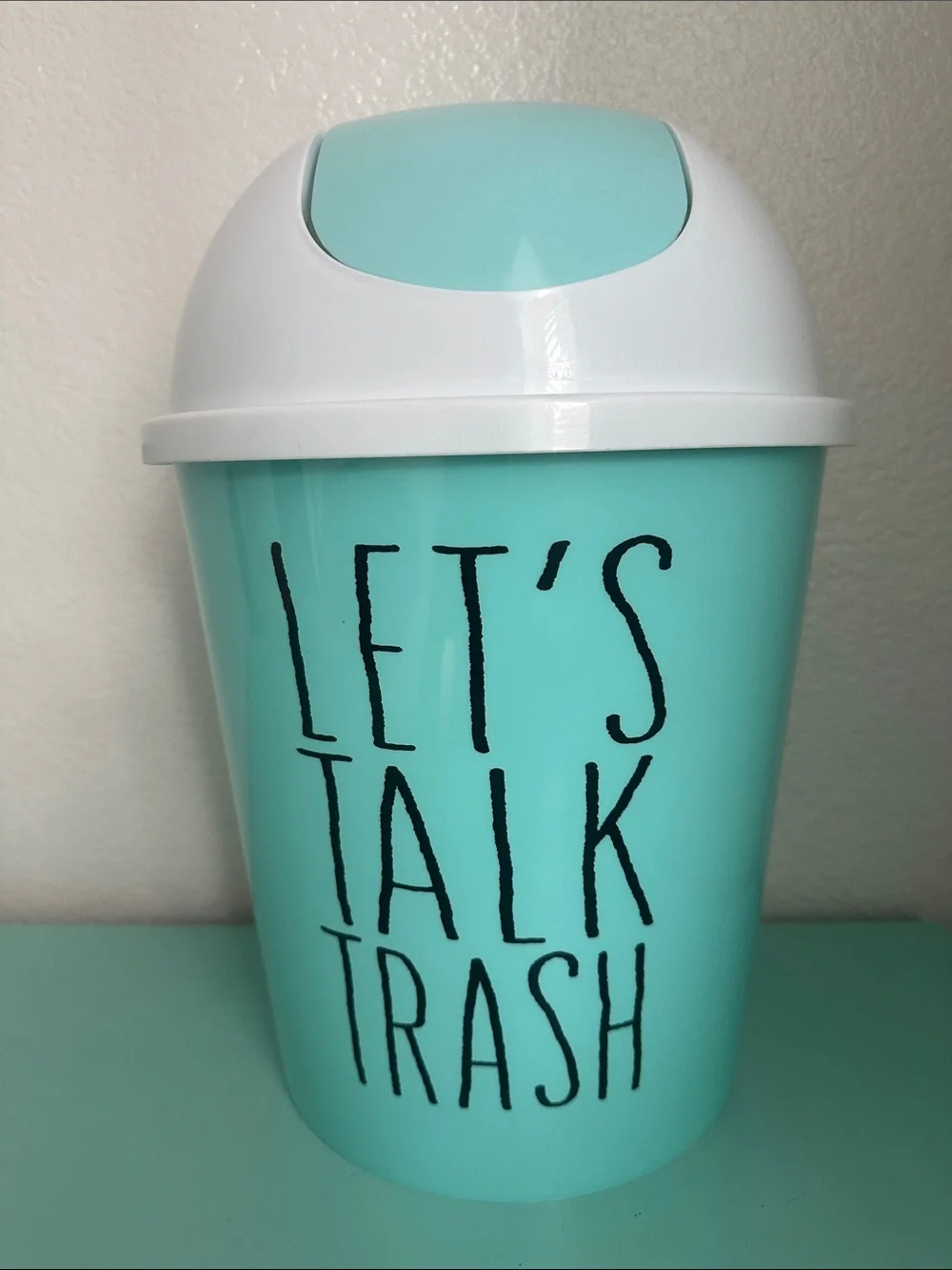 Essential Home Designs-basic plastic trash can with swinging top-new